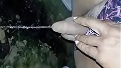 Pissing on ground in the night